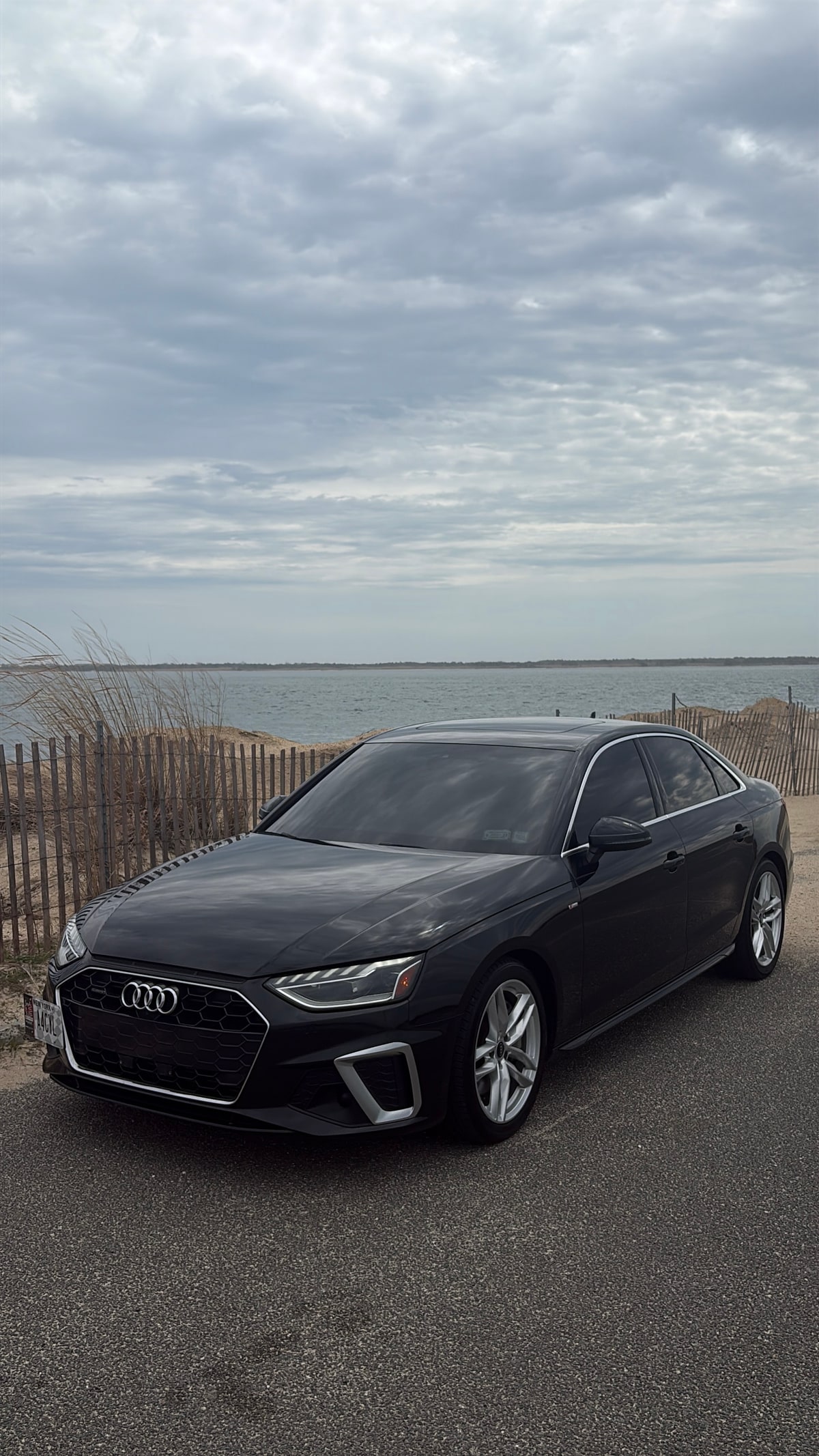 Stock black Audi A4 front angle by the beach